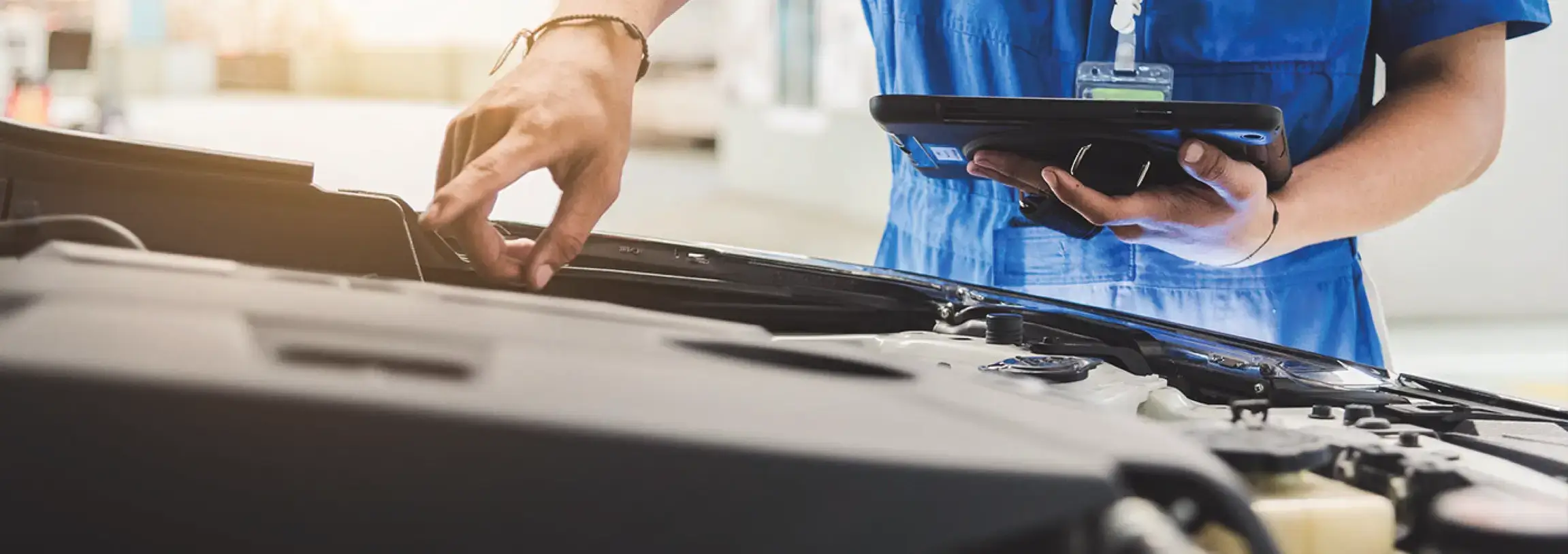 Tech works on vehicle
