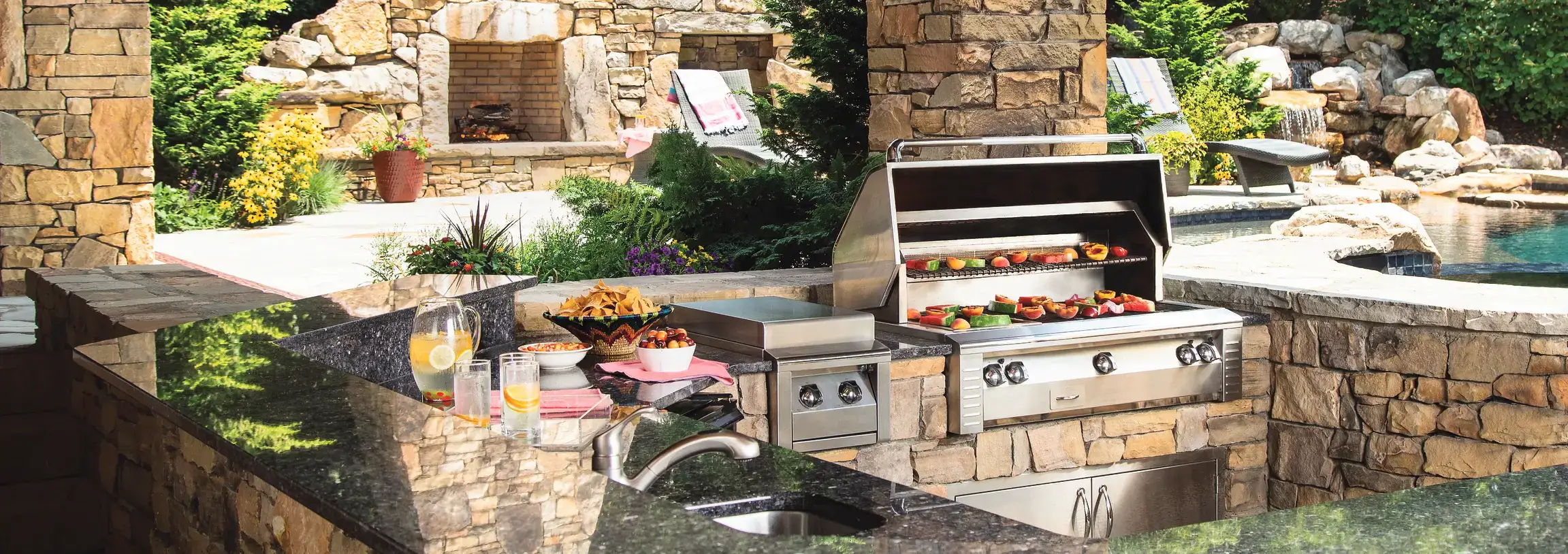 Outdoor Kitchen in backyard by pool