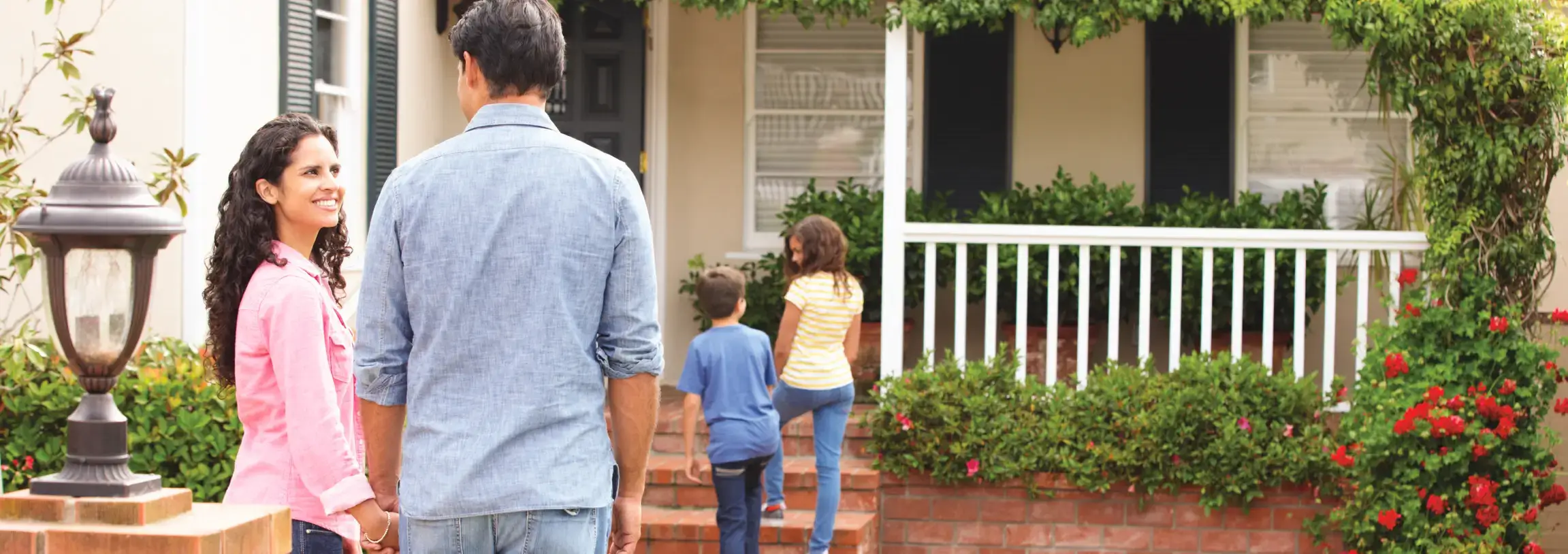 Family entering house