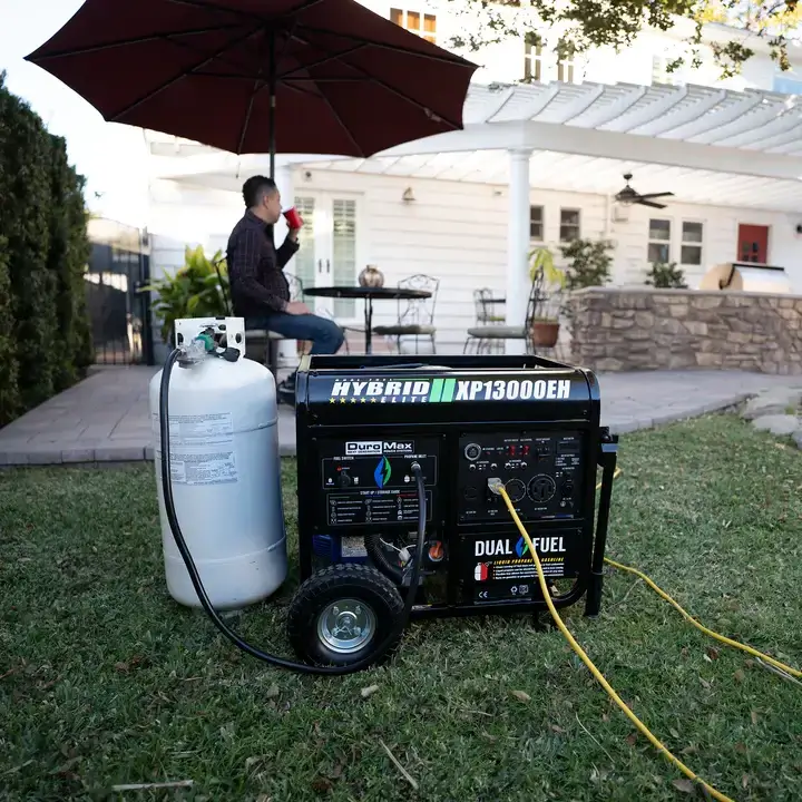 DuroMax XP13000EH being used in yard