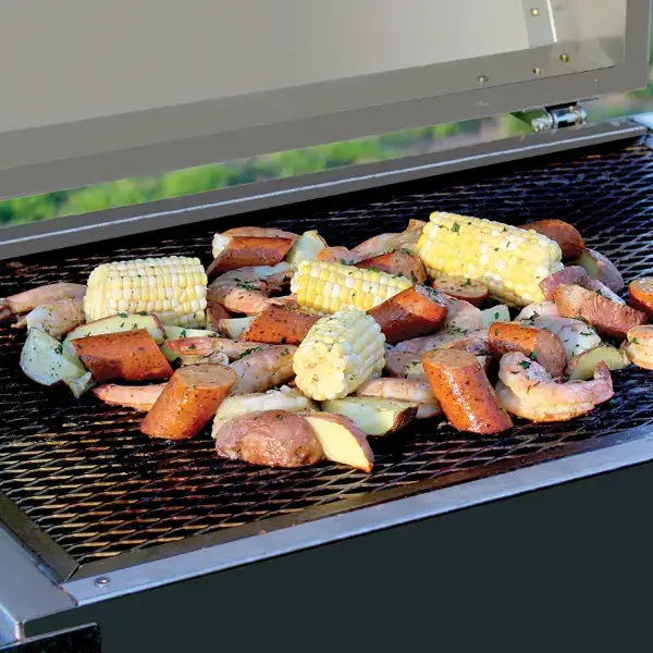 Food on top of a Phoenix SD Grill grill