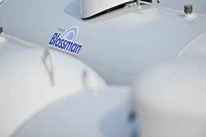 Propane tank with Blossman gas logo