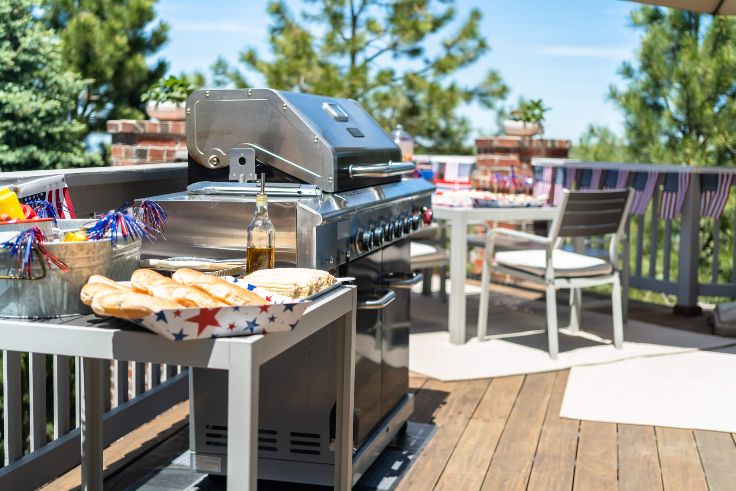 Hot dog bar with corn on the cob for July 4th celebration on the back patio.
